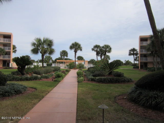 4 Ocean Trace Road, Unit 422 St. Augustine, FL 32080 - Photo 31 of 33 a view of a garden with a building in the background
