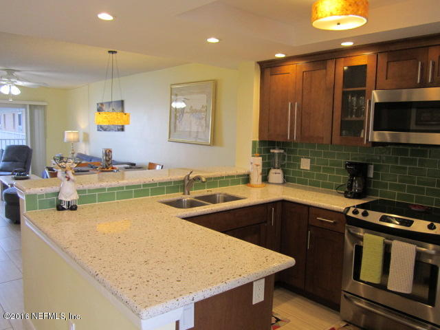4 Ocean Trace Road, Unit 422 St. Augustine, FL 32080 - Photo 5 of 33 a kitchen with a sink a counter top space and appliances