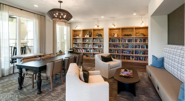 a living room with furniture a rug and a large window