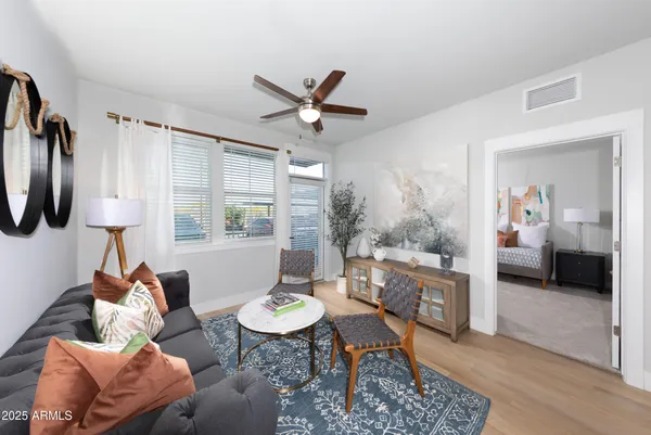a living room with furniture and a large window