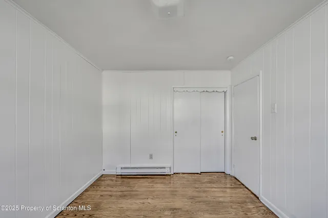 a view of cabinets and wooden floor