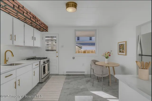 a view of a kitchen with cabinets