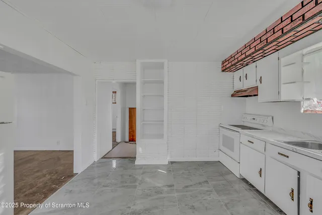 a bathroom with a sink a mirror and vanity