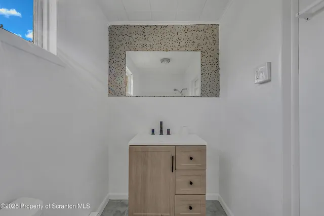 a bathroom with a bath tub and shower