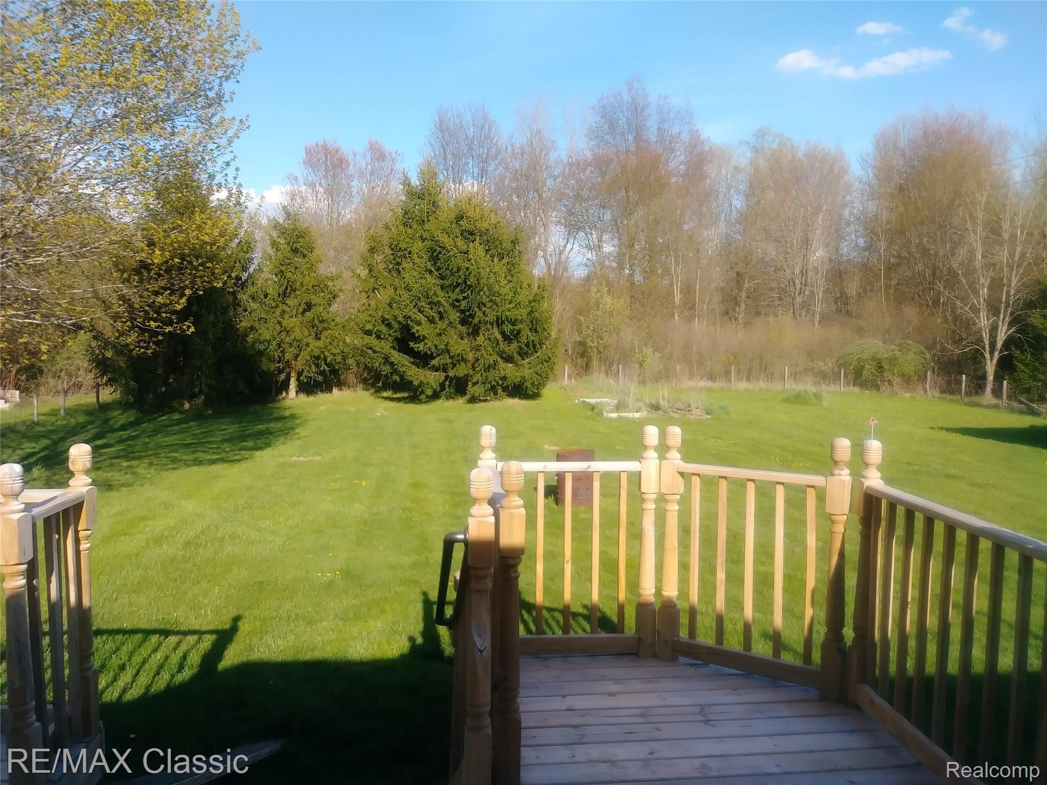 5406 Argentine Road Howell, MI 48855 - Photo 30 of 32 Argentine backyard deck.jpg