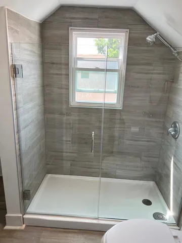 a bathroom with a shower and bathtub