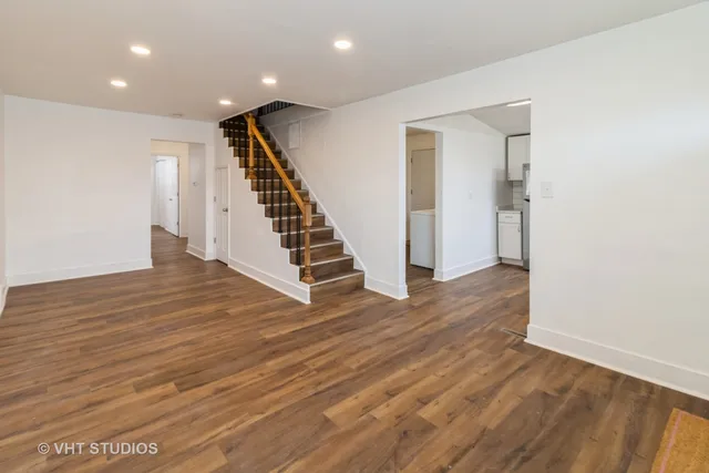 a view of entryway with wooden floor