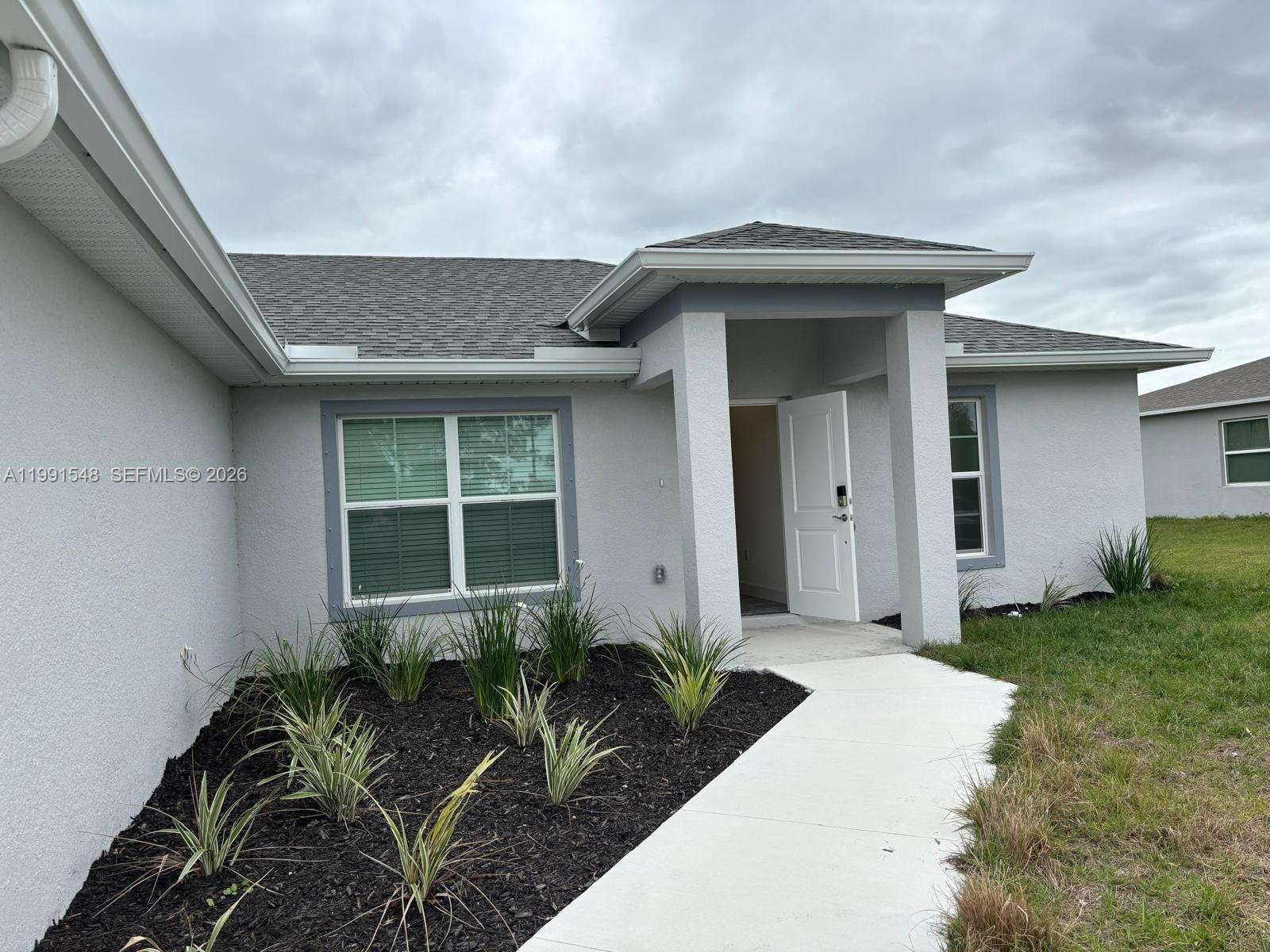 2711 20th Street Southwest Lehigh Acres, FL 33976 - Photo 1 of 11