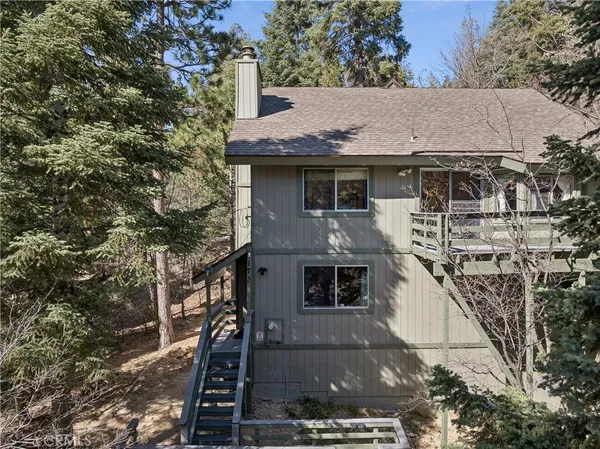 a aerial view of a house with a yard