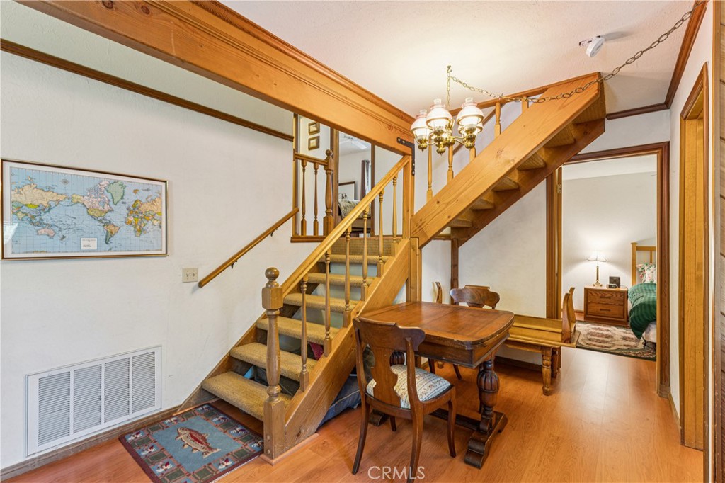 175 Massive Blue Jay, CA 92317 - Photo 22 of 40 a living room with furniture and a chandelier