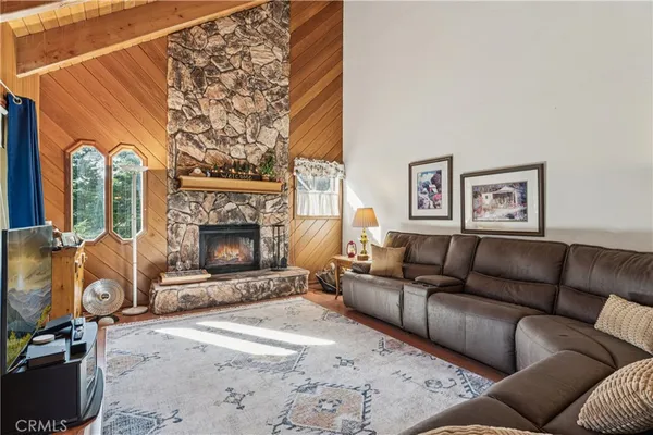 a living room with furniture and a rug