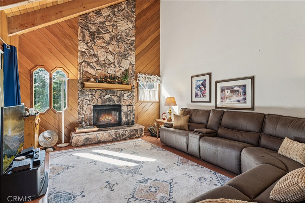 175 Massive Blue Jay, CA 92317 - Photo 30 of 40 a living room with furniture a flat screen tv and a fireplace