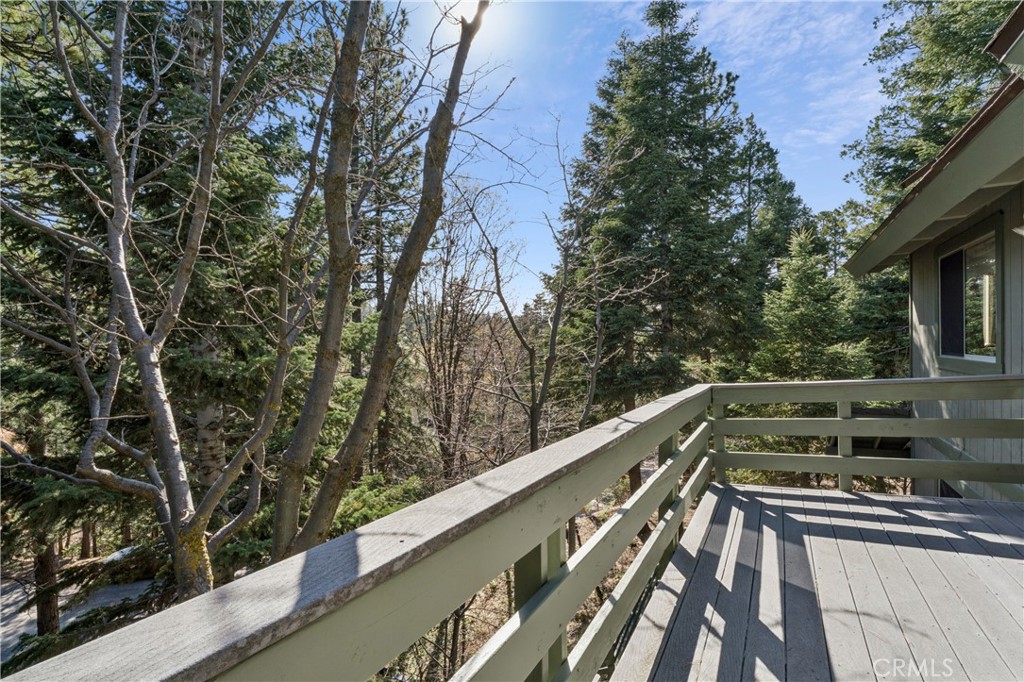 175 Massive Blue Jay, CA 92317 - Photo 34 of 40 a view of balcony with wooden floor and fence
