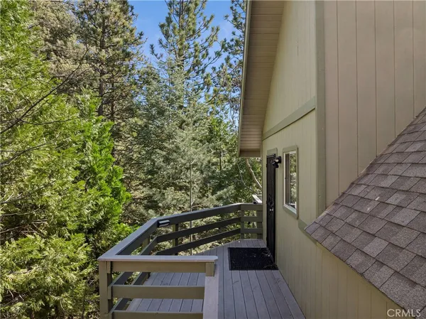 a view of balcony with wooden floor