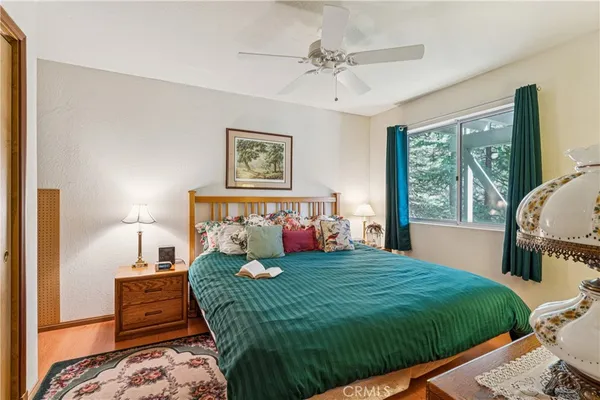 a bed sitting in a bedroom next to a window