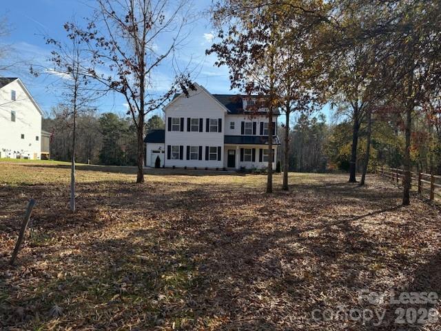 8829 Wingard Road Waxhaw, NC 28173 - Photo 1 of 21 a view of a house with a yard