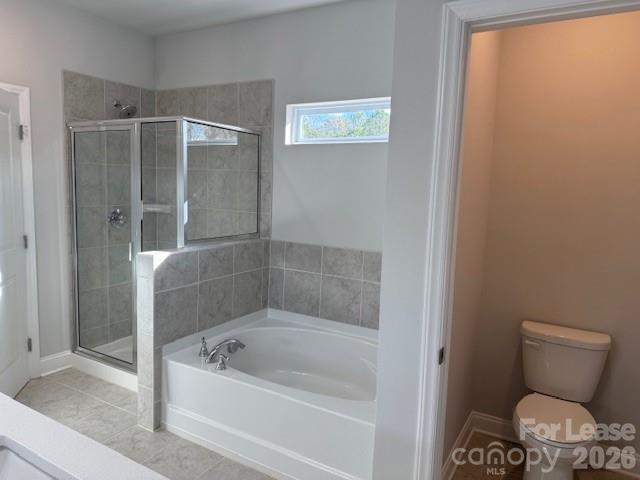 8829 Wingard Road Waxhaw, NC 28173 - Photo 12 of 21 a bathroom with a toilet and a shower