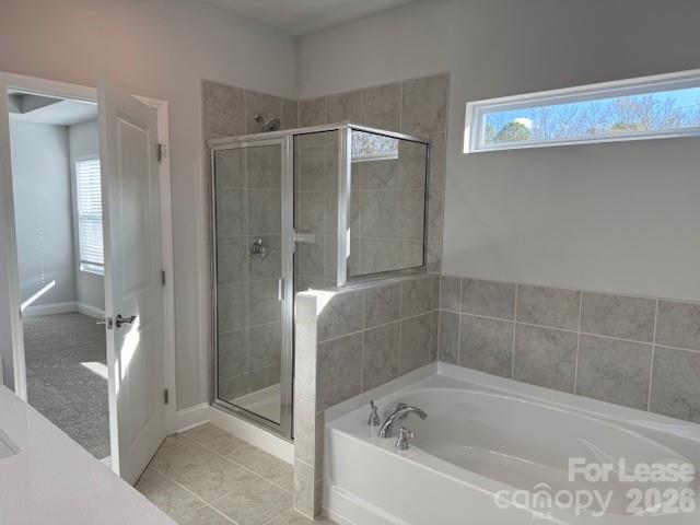 8829 Wingard Road Waxhaw, NC 28173 - Photo 14 of 21 a bathroom with a bathtub and shower