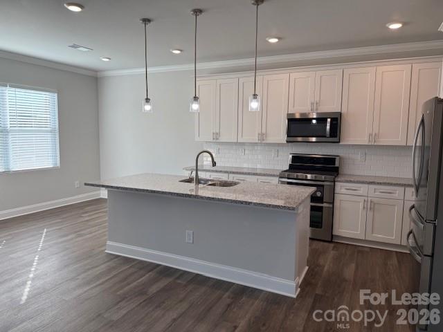 8829 Wingard Road Waxhaw, NC 28173 - Photo 3 of 21 a kitchen with kitchen island a sink stainless steel appliances and cabinets