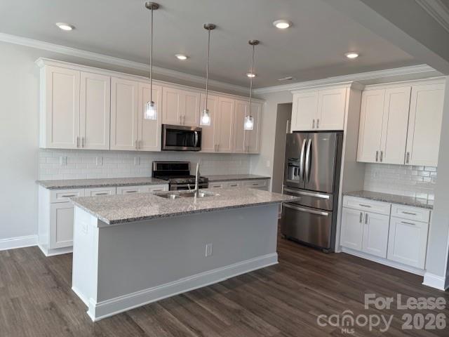 8829 Wingard Road Waxhaw, NC 28173 - Photo 5 of 21 a kitchen with stainless steel appliances granite countertop a stove a refrigerator a sink a microwave and white cabinets