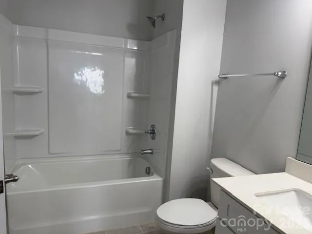 a bathroom with a toilet a sink and bathtub