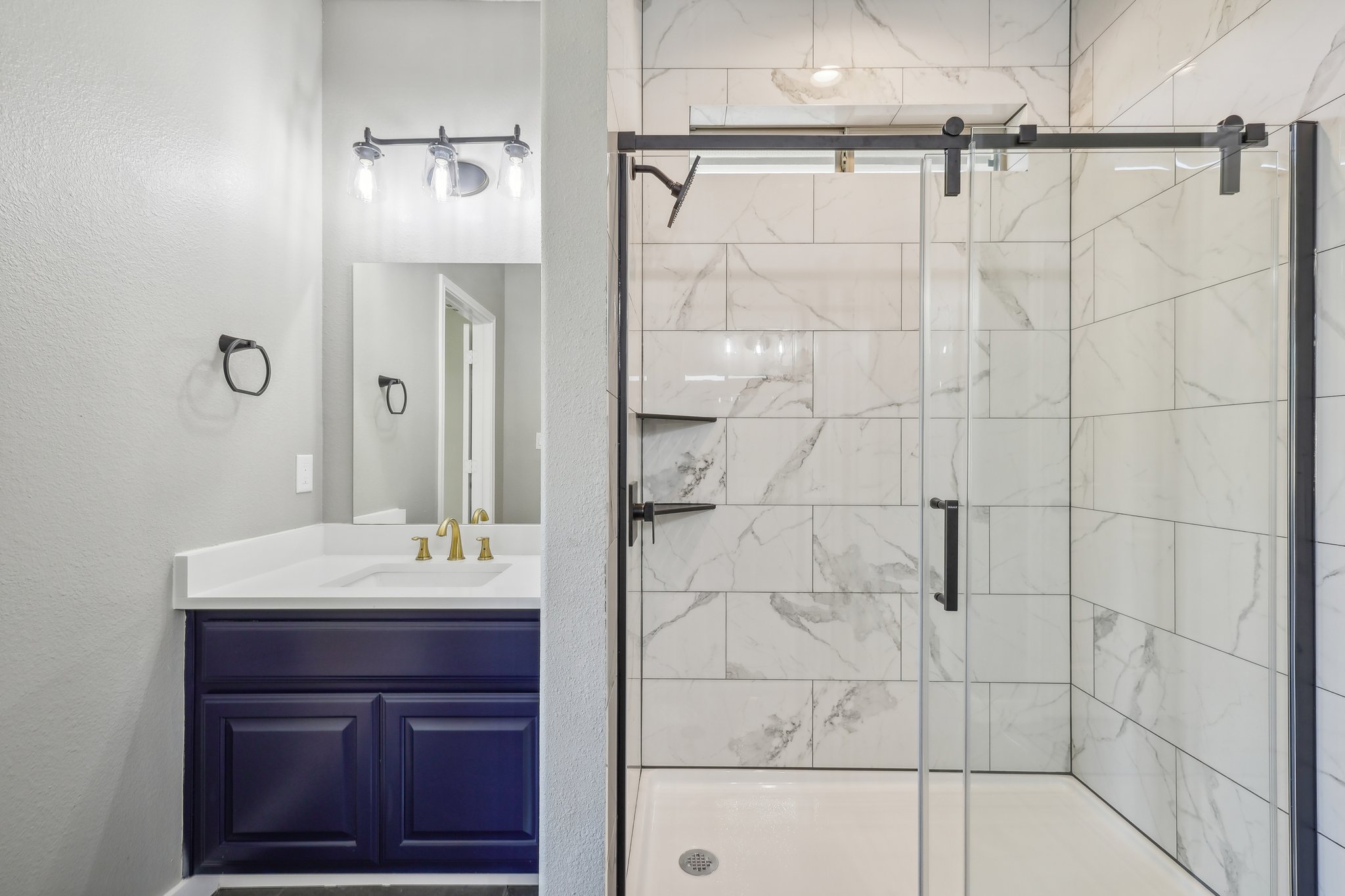 7324 Moon Rock Road Austin, TX 78739 - Photo 17 of 30 a bathroom with a sink shower and a mirror