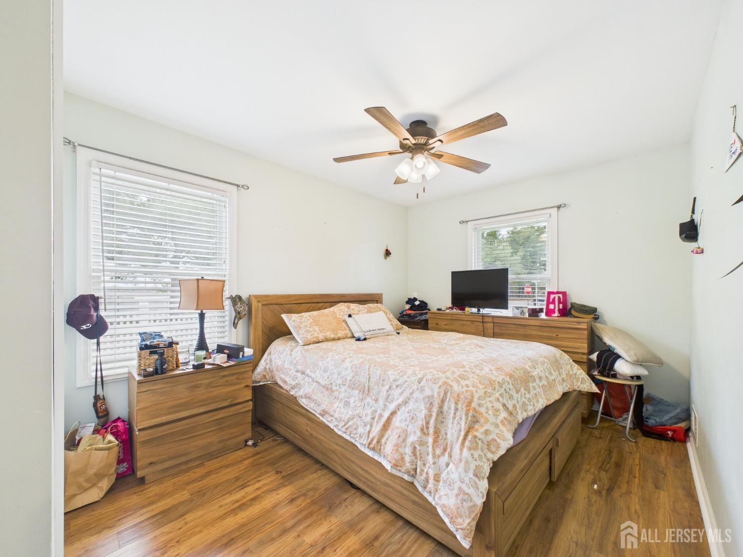 67 Columbus Avenue Edison, NJ 08817 - Photo 14 of 23 a bedroom with a bed and a chandelier