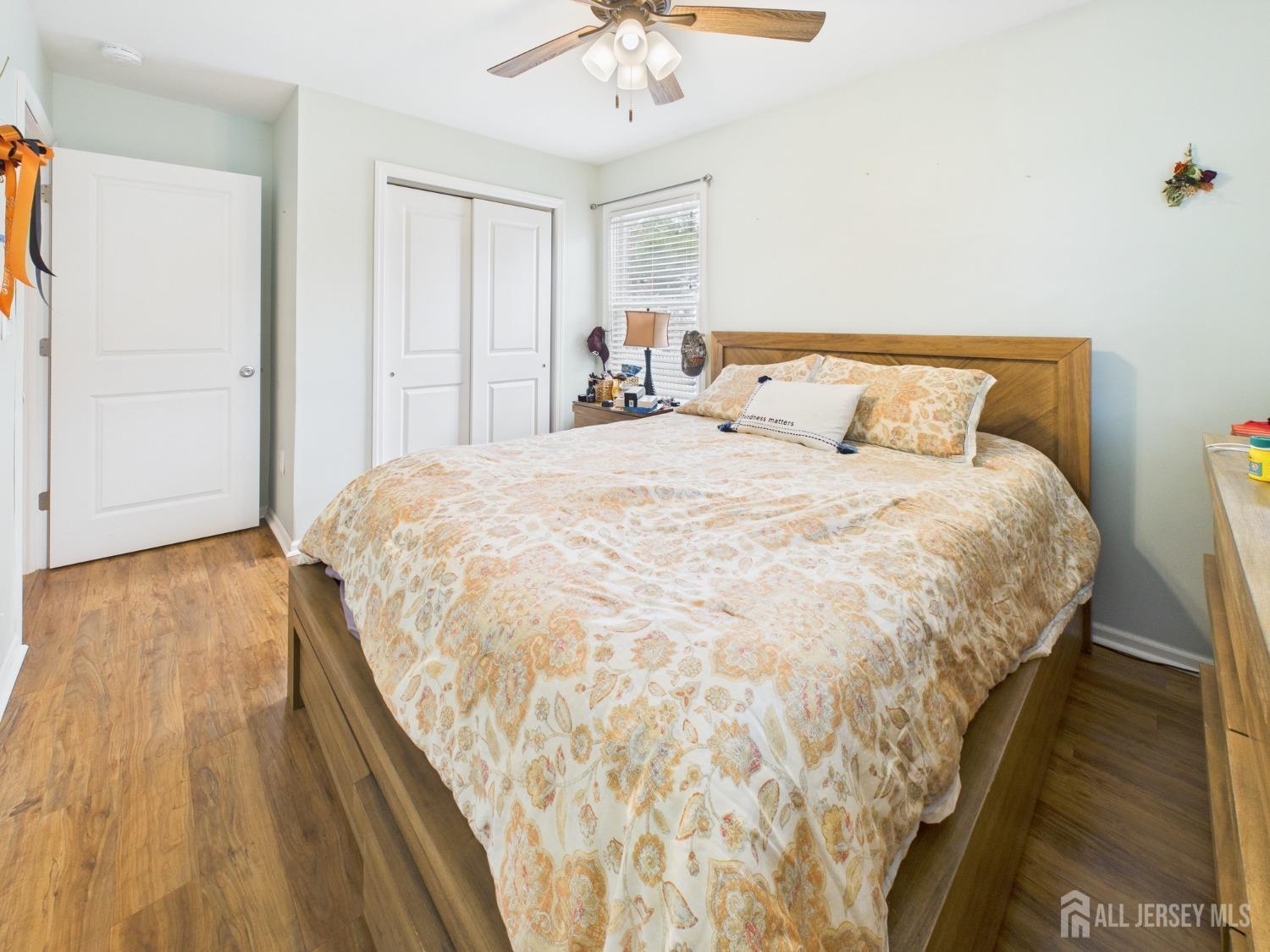 67 Columbus Avenue Edison, NJ 08817 - Photo 15 of 23 a spacious bedroom with a bed and a chandelier