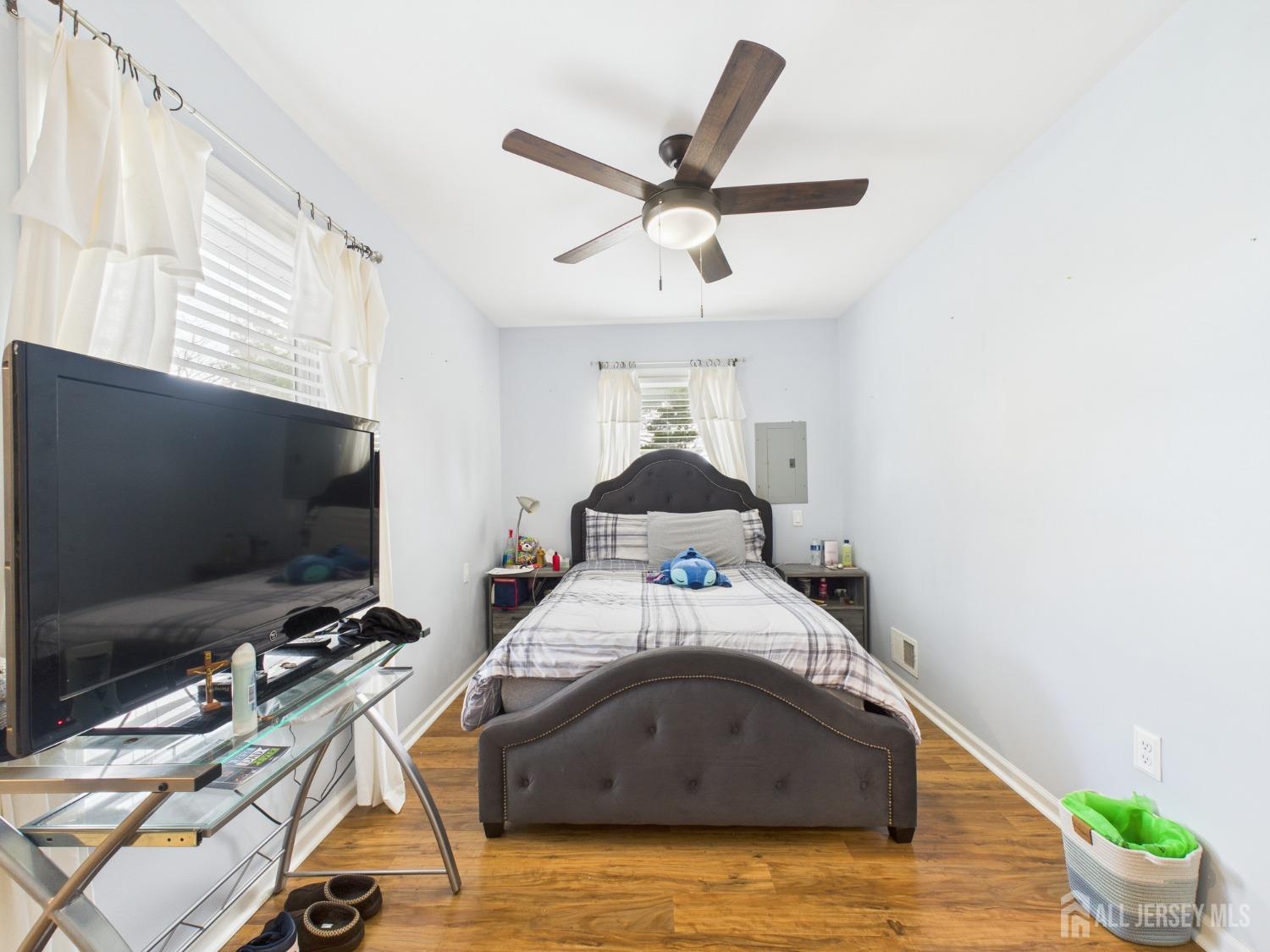 67 Columbus Avenue Edison, NJ 08817 - Photo 17 of 23 a bedroom with a bed and a flat screen tv