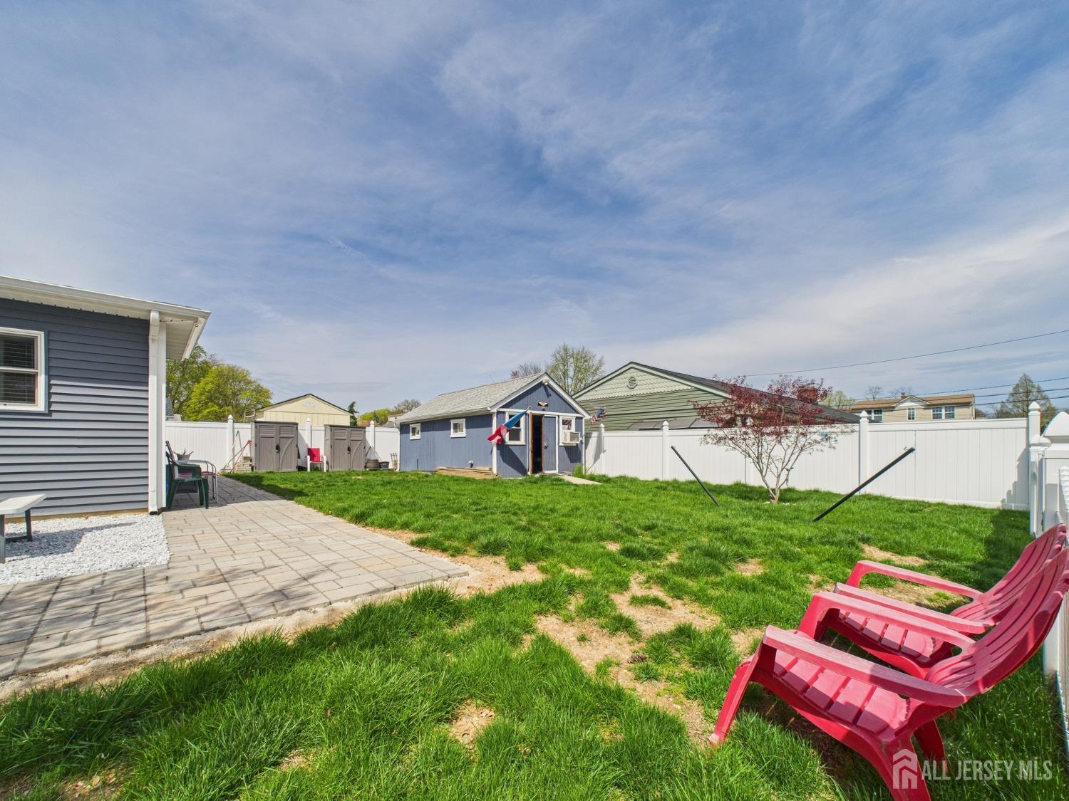 67 Columbus Avenue Edison, NJ 08817 - Photo 21 of 23 a view of a yard with table and chairs