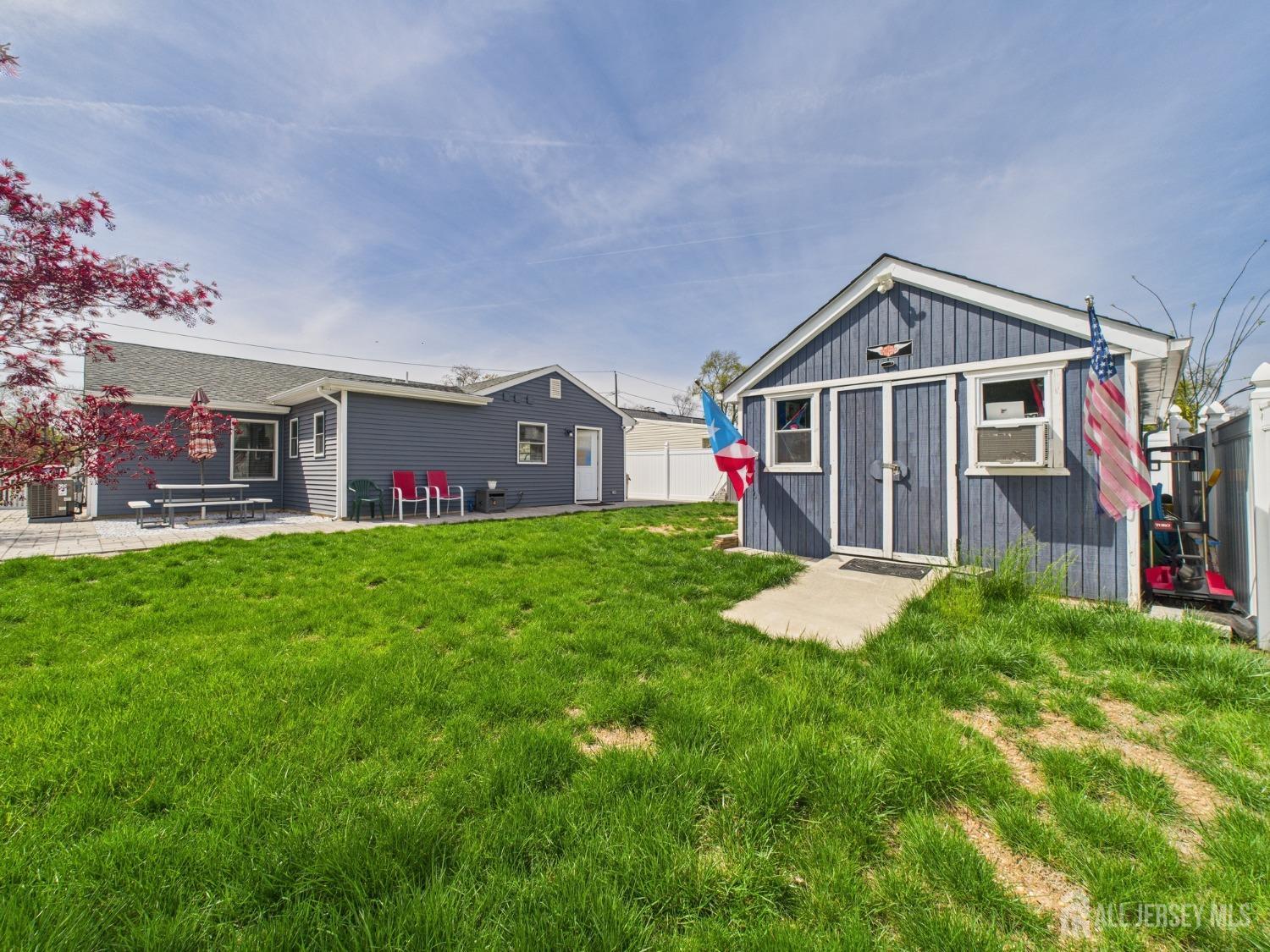 67 Columbus Avenue Edison, NJ 08817 - Photo 22 of 23 a front view of house with yard and green space