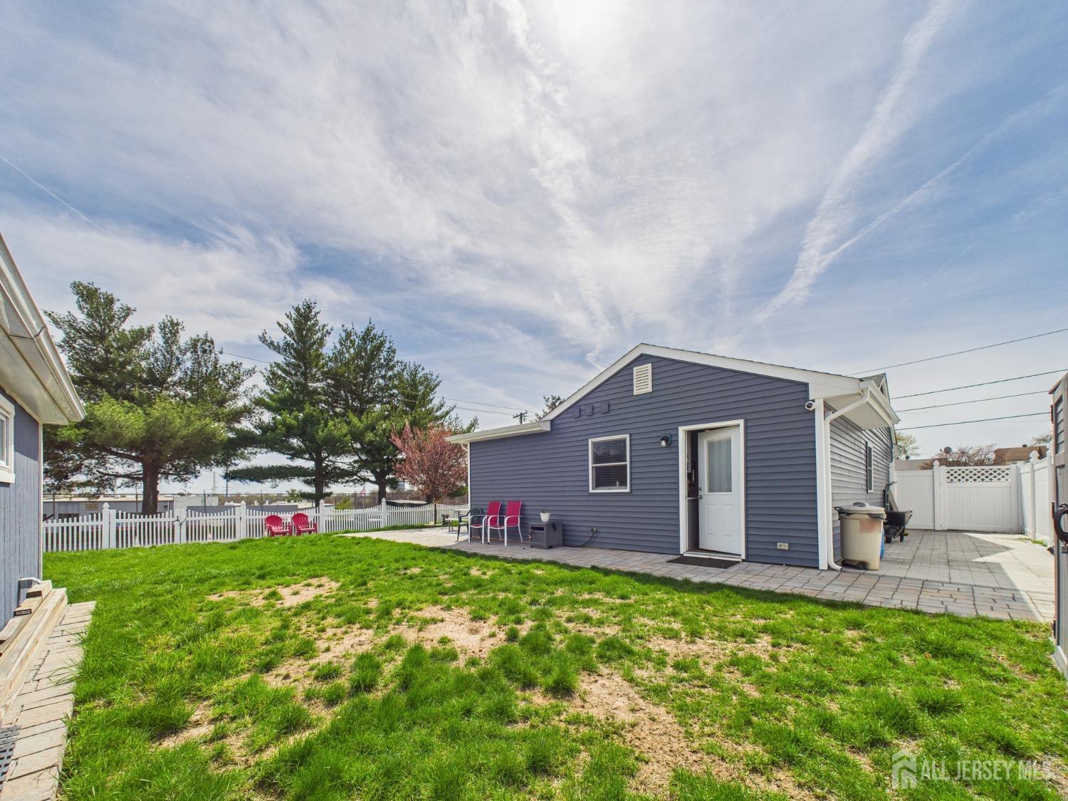 67 Columbus Avenue Edison, NJ 08817 - Photo 23 of 23 a front view of house with yard and entertaining space