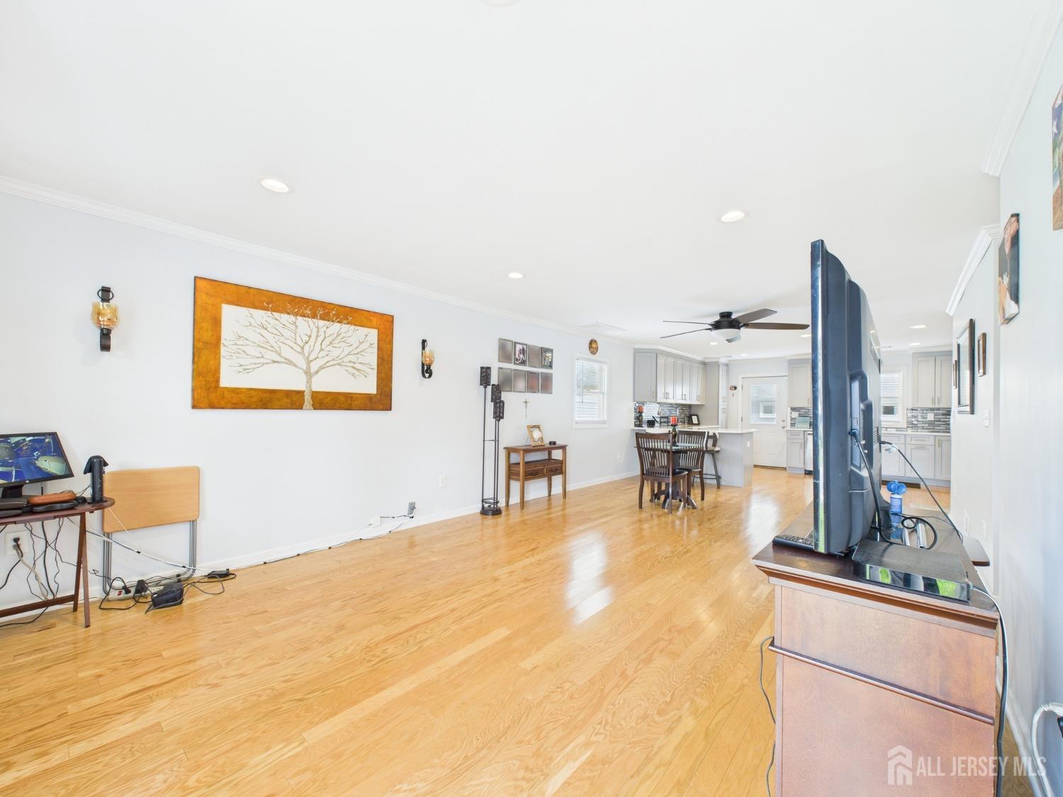 67 Columbus Avenue Edison, NJ 08817 - Photo 3 of 23 a room with lots of chairs and a table