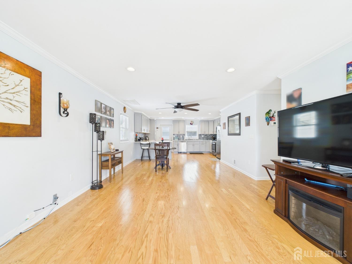 67 Columbus Avenue Edison, NJ 08817 - Photo 4 of 23 a living room with furniture and a flat screen tv