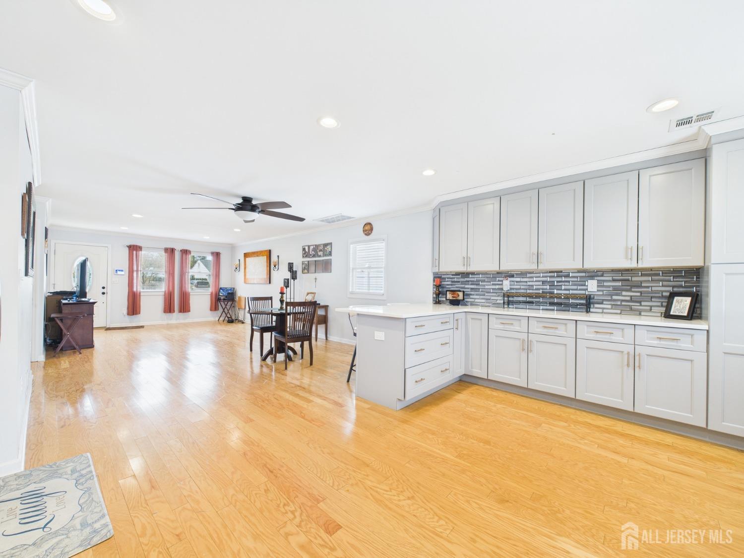 67 Columbus Avenue Edison, NJ 08817 - Photo 7 of 23 a kitchen with stainless steel appliances granite countertop a stove and white cabinets
