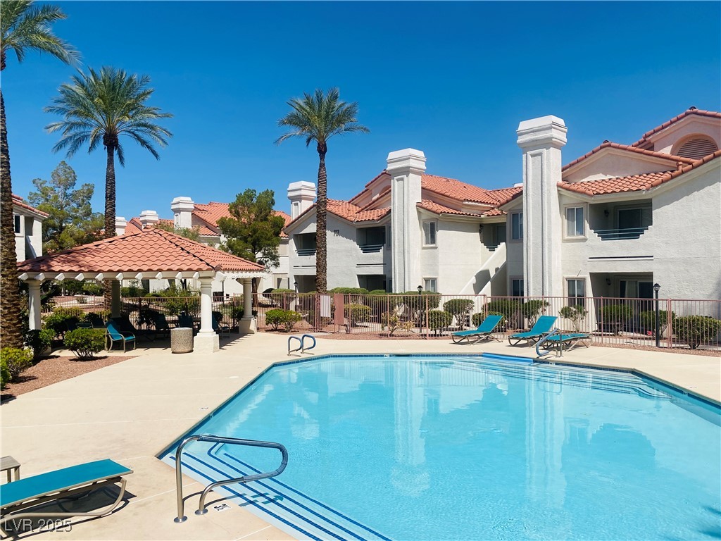 Community pool with a patio and a gazebo