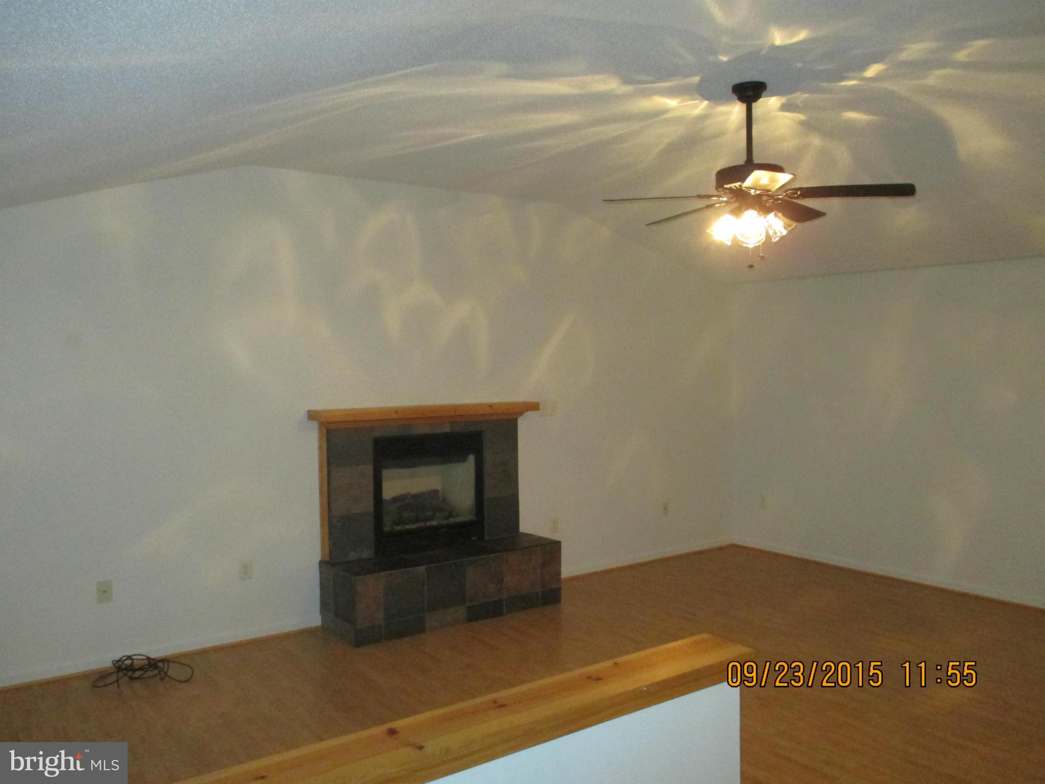 224 Cliff Road Linden, VA 22642 - Photo 3 of 15 a room with a table and chandelier fan