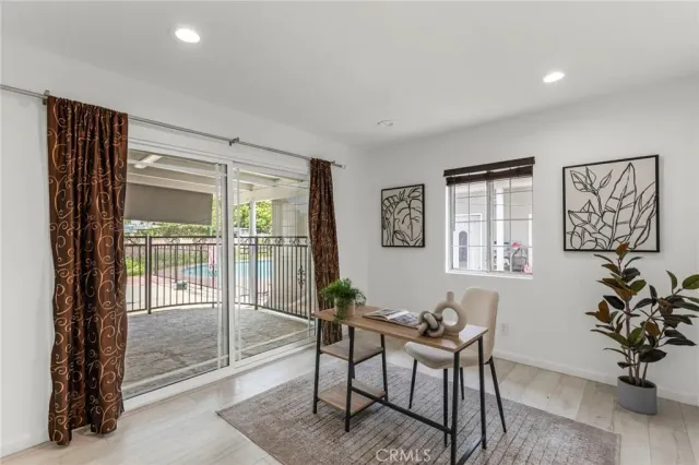 a bathroom with a granite countertop double vanity sink a mirror and a toilet