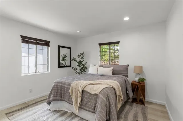 a bed room with a bed and a window