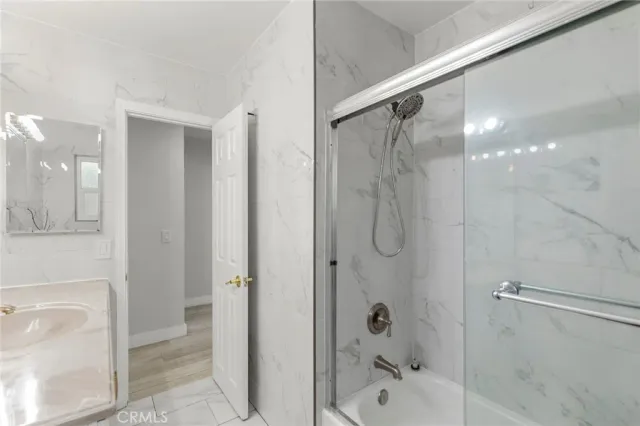 a bed room with a bed and a large window