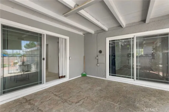 a kitchen with granite countertop a sink stove and cabinets