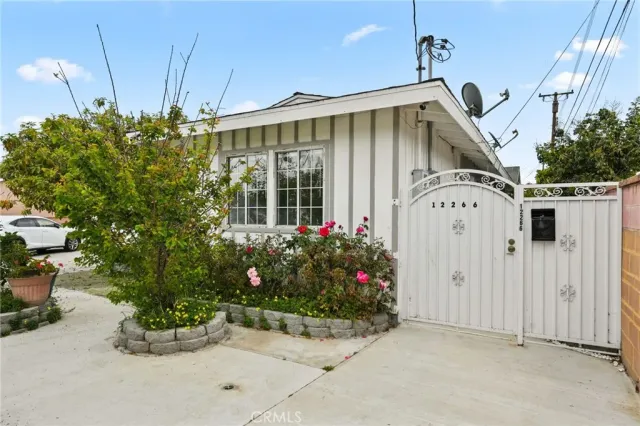 a spacious bathroom with a granite countertop sink a toilet and mirror
