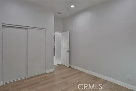 a bathroom with a granite countertop sink and a shower