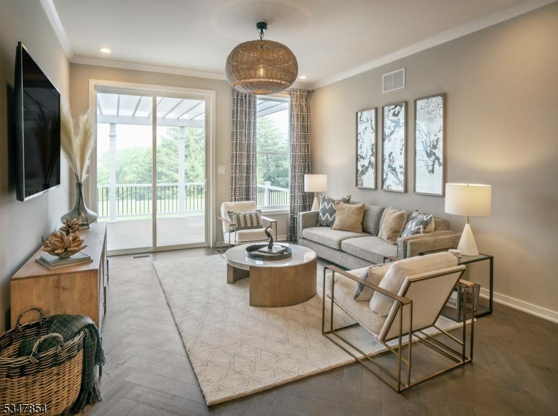 2 Blackmoor Lane Randolph, NJ 07869 - Photo 11 of 25 a living room with furniture a flat screen tv and a large window