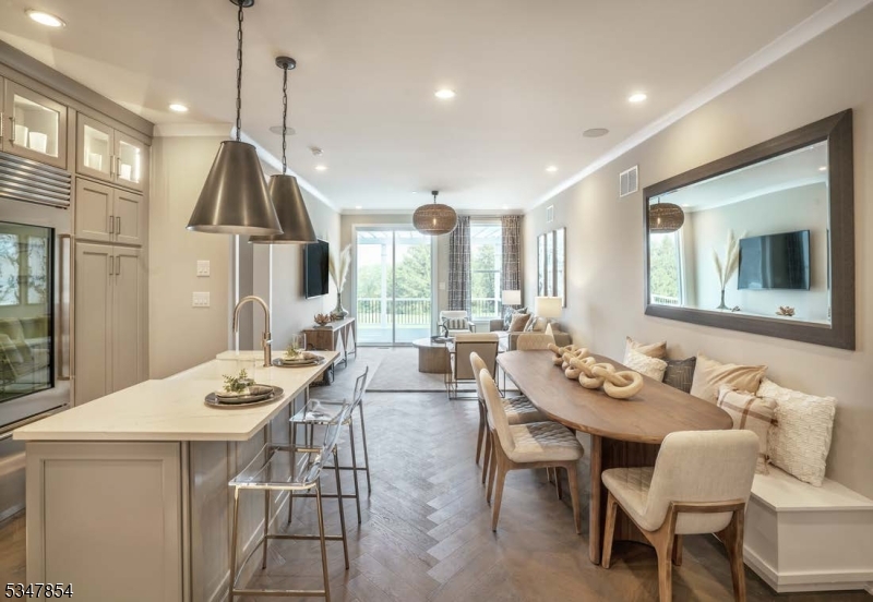 2 Blackmoor Lane Randolph, NJ 07869 - Photo 9 of 25 a view of a dining room and livingroom with furniture wooden floor a chandelier