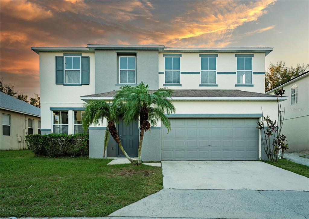 347 Kettering Road Davenport, FL 33897 - Photo 1 of 1 a front view of a house with a garden
