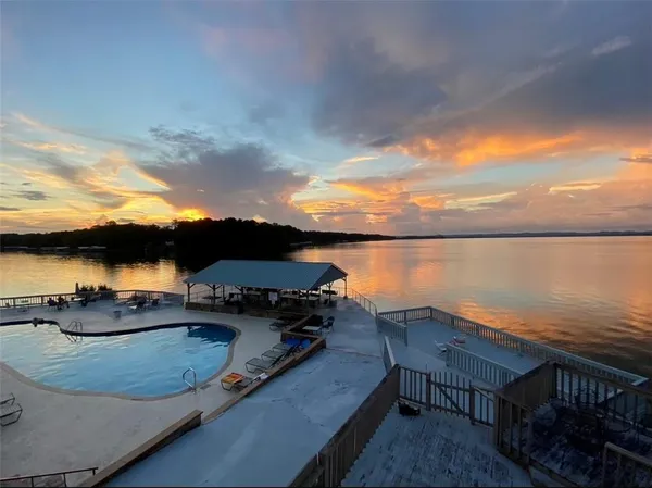 a view of a lake with outdoor seating
