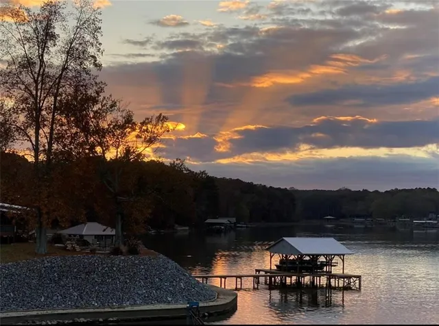 a view of a lake with a house in the background