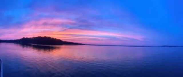 a view of a lake with couches