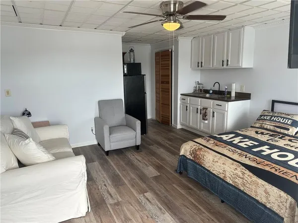 a living room with furniture and a rug